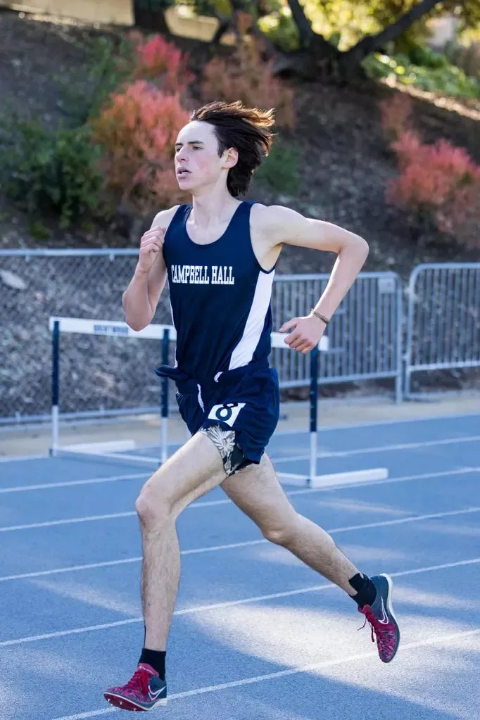 Campbell Hall track athlete mid-stride
