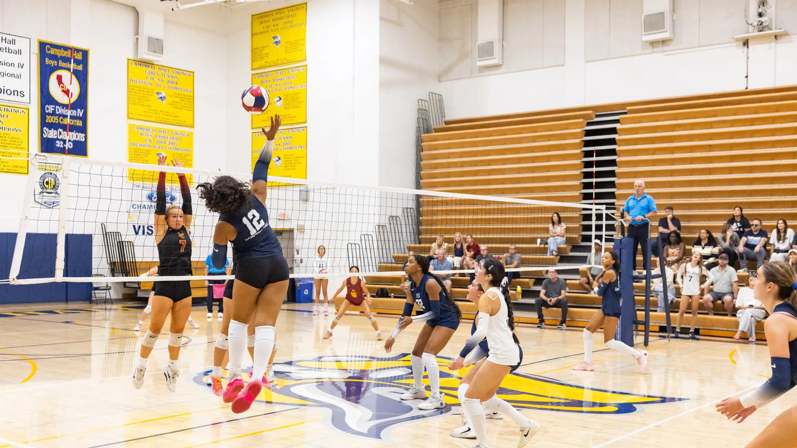 Campbell Hall girls volleyball player spiking at the net