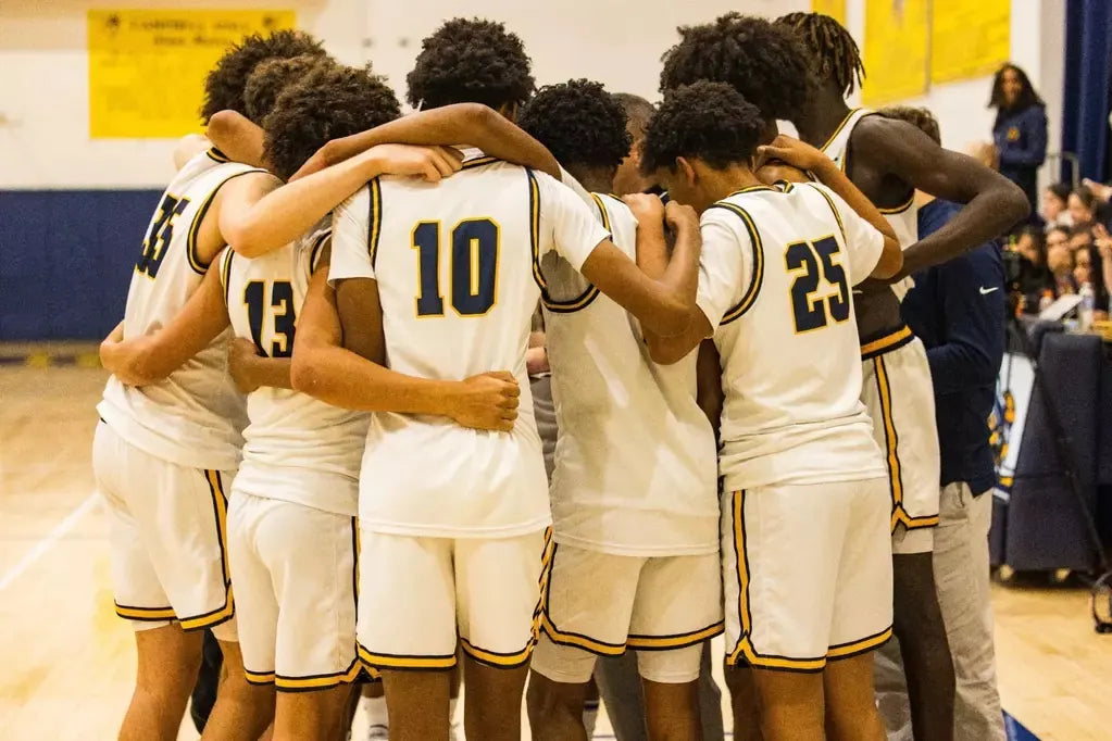 Campbell Hall basketball team in a huddle