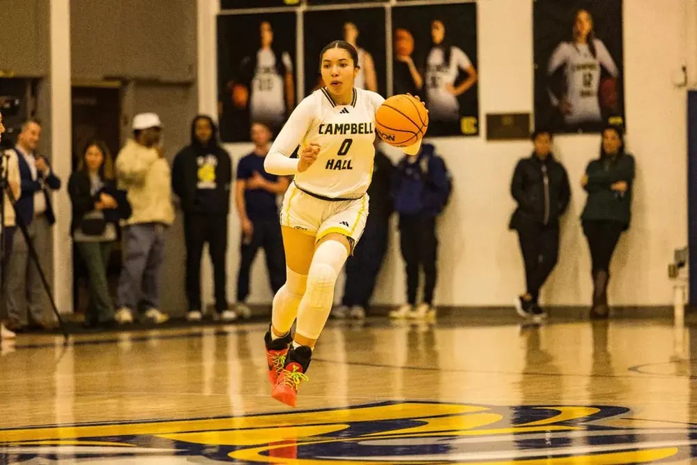 Campbell Hall basketball player dribbling up the court
