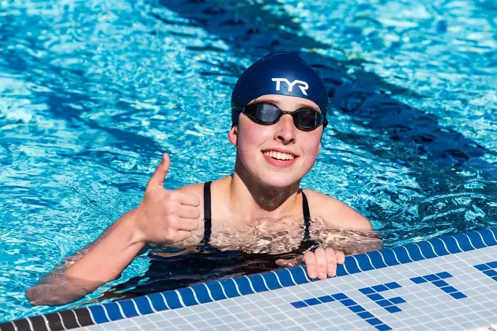 Campbell Hall swimmer giving a thumbs up from the pool