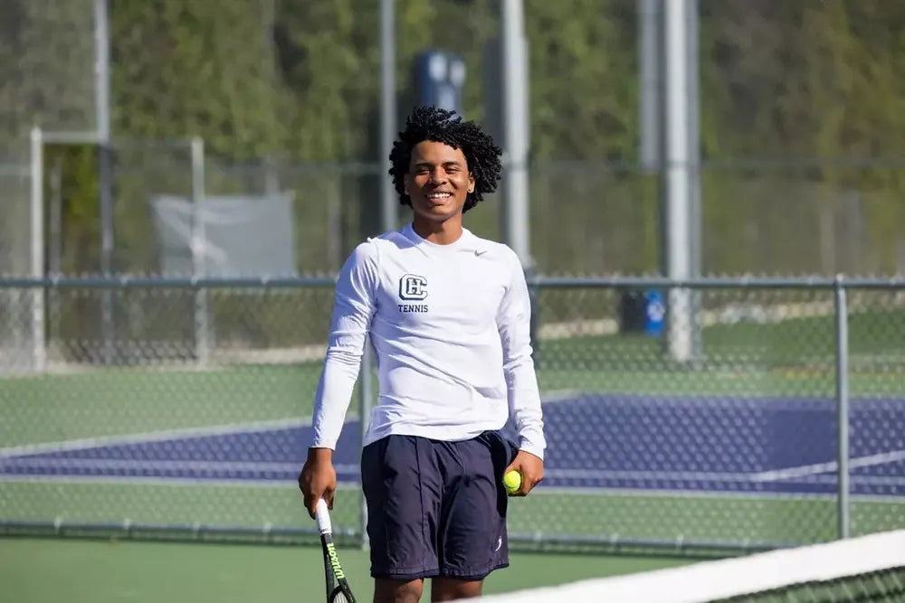 Campbell Hall tennis player smiling on court
